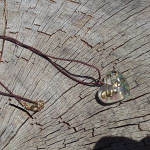 Clear resin heart necklace with antique safety pin